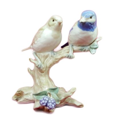 Porcelain Birds Sitting On Tree
