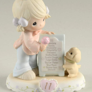 Porcelain figurine of girl with ice cream cone with puppy