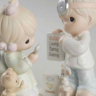 Porcelain figurine of Boy And Girl Doing Eye Exam