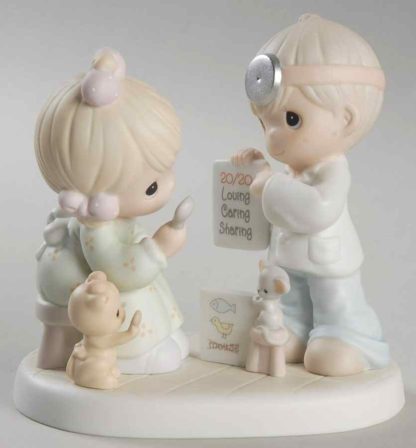 Porcelain figurine of Boy And Girl Doing Eye Exam
