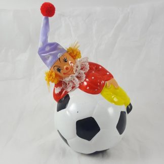 Clown Laying On Soccer Ball Bank