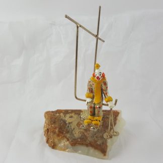 Gold Clown Skiing On Rock with Ski Lift