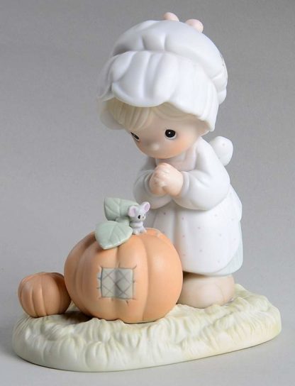 porcelain figurine features a girl with pumpkins