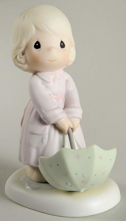 porcelain figurine of The Sun is Always Shining featuring child with green umbrella