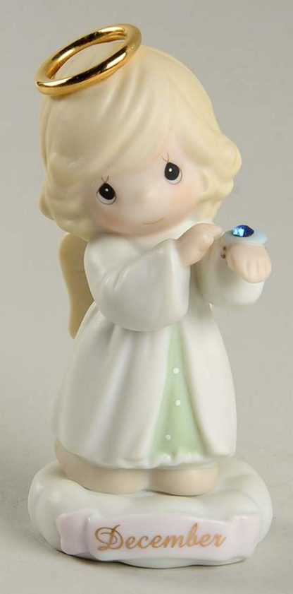This porcelain figurine depicts an angel with a gold halo and birthstone (zircon rhinestone).