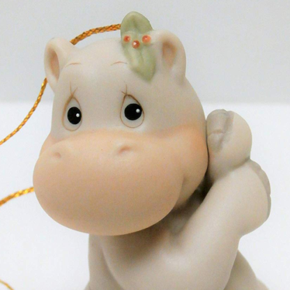 Porcelain ornament features a hippopotamus garland belt dated 1995.