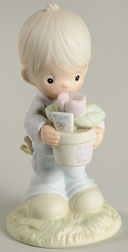 Precious Moments To a Special Mum porcelain figurine depicting a boy holding a flower pot