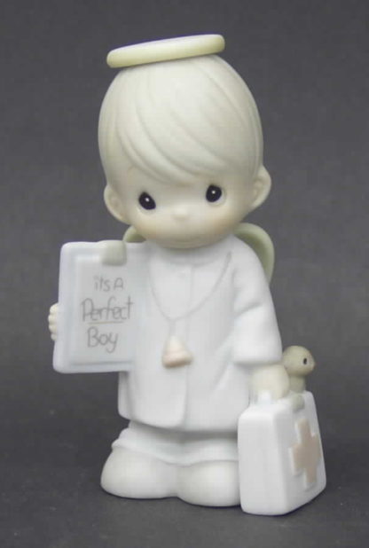 Precious Moments It's a Perfect Boy (Miniature Nativity Addition) #525286. This porcelain figurine depicts an Angel with a doctor bag and Baby Boy sign.