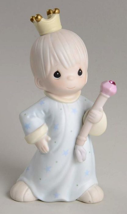 Precious Moments A Prince Of A Guy #526037. This porcelain figurine depicts a boy with a crown, robe and jeweled staff.