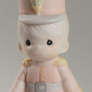 Porcelain Ornament depicts a soldier boy.