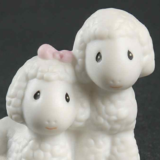 Porcelain figurine depicting boy and girl sheep