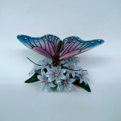 Butterfly on flowers figurine - front