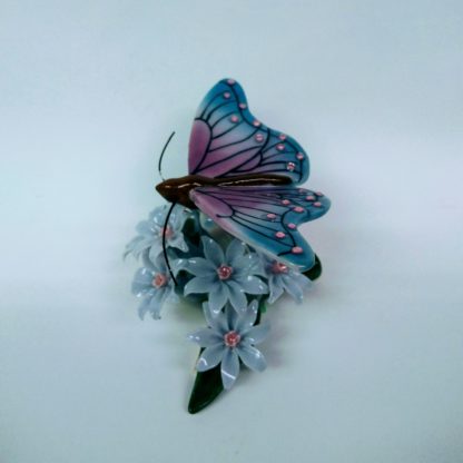Butterfly on flowers figurine - left