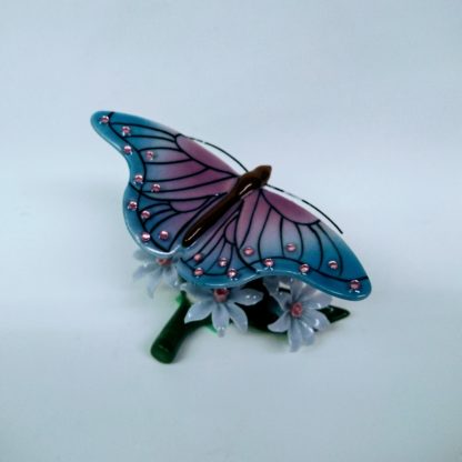 Butterfly on flowers figurine - back