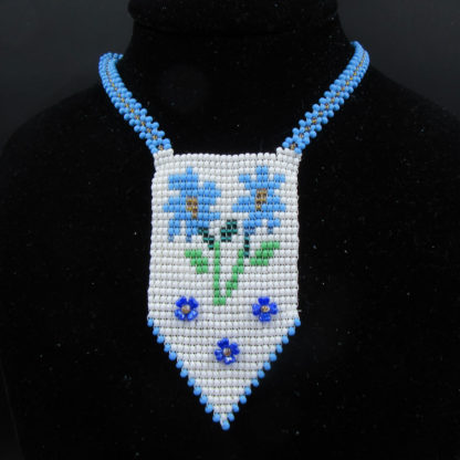 Native American hand-beaded pendant of flowers