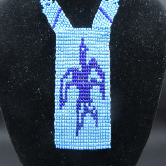 Handmade Native American Beadwork authentic necklace. Blue panel "Apache" features bird in flight.